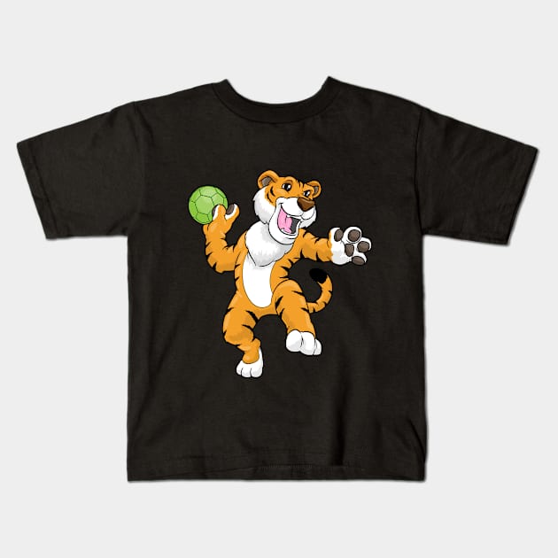 Tiger as handball player with handball Kids T-Shirt by Markus Schnabel